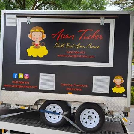 The Asian Tucker catering van, branded with the monkey logo, ready for functions and events