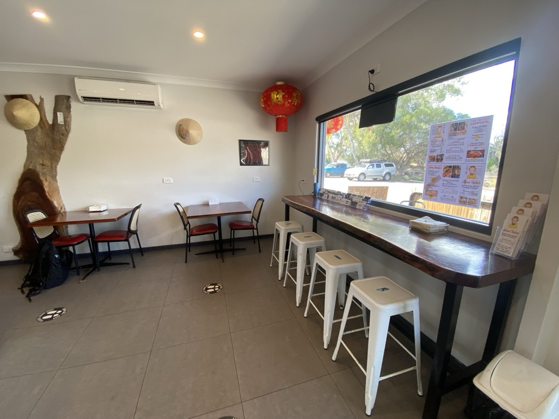 Eat-in seating at Asian Tucker in Tanunda, with a window bench, stools and small tables