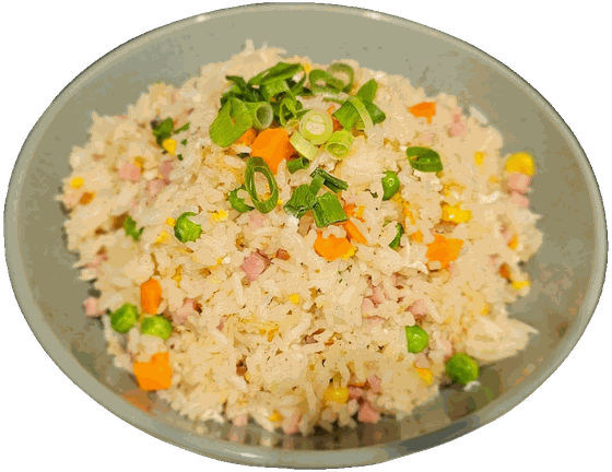 A bowl of fried rice with peas, carrot and spring onion
