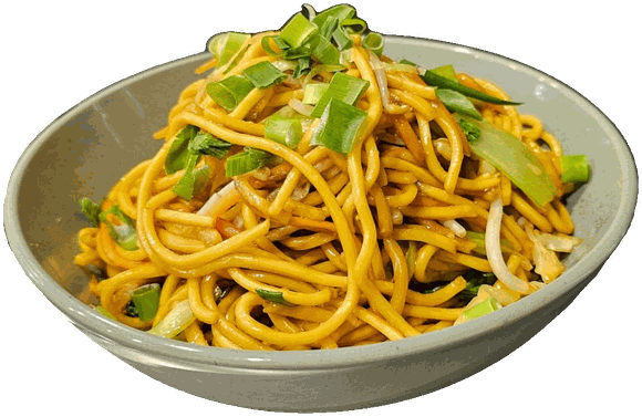 A bowl of fried noodles topped with fresh greens